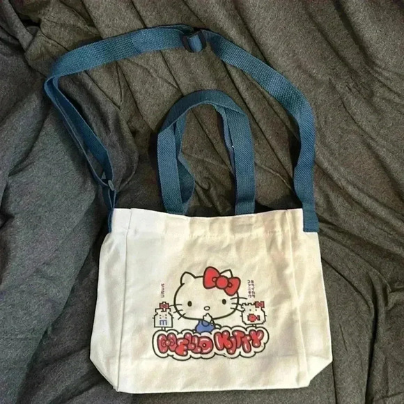 Hello Kitty white canvas tote with blue handles. - Picture 1 of 7